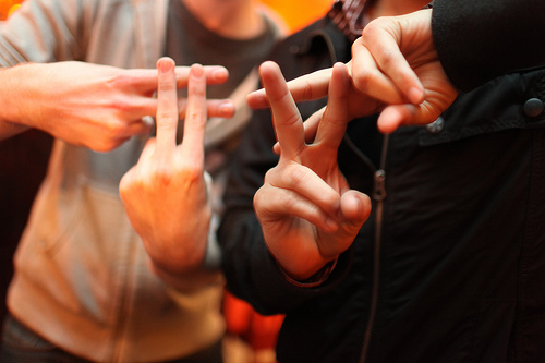 People making hashtags with their fingers