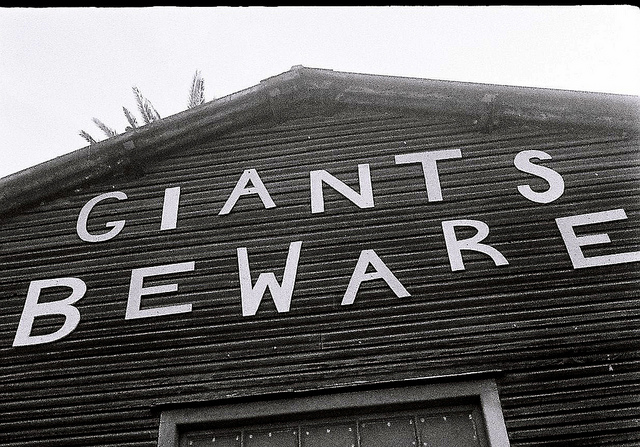 Sign on barn "Giants Beware"